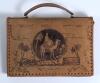 M.C.C. tour to Pakistan 1955/56. Ken Barrington. Surrey & England 1953-1968. Original leather handbag bought by Barrington for his wife Ann from the tour of Pakistan. The leather bag with traditional Indian scenes to sides and to one side signed by sixte
