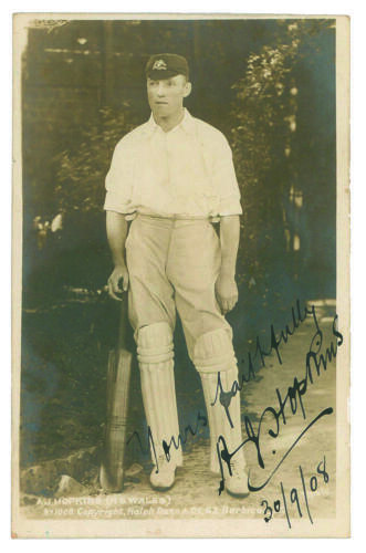 Albert John Young Hopkins. New South Wales & Australia. 1896-1914. Sepia postcard of Hopkins, full length, in batting attire wearing Australian cap and holding a bat to side. Nicely signed, Yours faithfully&rsquo; in black ink by Hopkins and dated &lsquo;30/9/1908. R