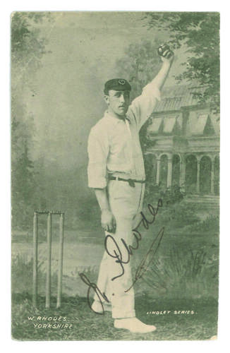 Wilfred Rhodes. Yorkshire & England 1898-1930. Mono printed postcard of Rhodes, full length, in bowling pose, wearing cap. Signed in black ink by Rhodes &lsquo;Studio&rsquo; portrait by Lindley. Some wear to edges and odd corner otherwise in good condition