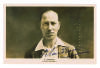 Andrew Sandham. Surrey & England 1911-1937. Mono real photograph postcard of Sandham, head and shoulders in M.C.C. blazer. Nicely signed in black ink by Sandham Nice image. Publisher unknown. Good/very good condition