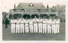 India tour to England 1952. Original mono real photograph plain back postcard of the India team lined up in one row wearing cricket attire in front of the pavilion for the tour match at Scarborough v T.N. Pearce&rsquo;s XI, 10th- 12th September 1952. Players in