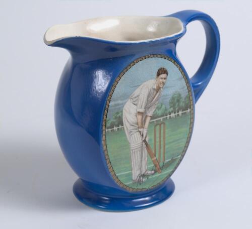 Arthur Percy Frank Chapman. Kent & England 1924-1938. Newhall Pottery blue water jug printed with an oval colour portrait of Chapman, in roundall, in batting stance at the crease to one side, cricket bats, wicket and balls within a shield to the reverse. 
