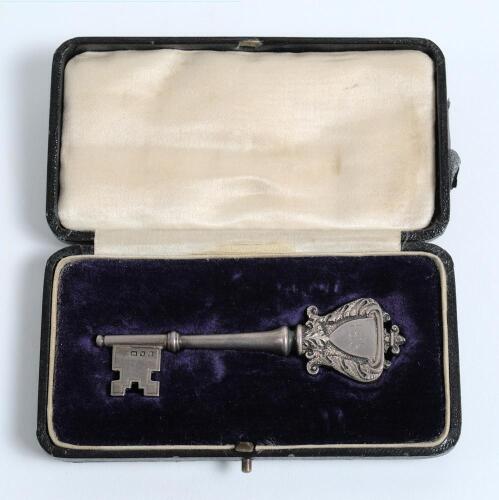 Samuel Moses James Woods, Somerset, England & Australia 1886-1910. A silver hall-marked key presented to Woods. The highly decorative key has the initials to the head (bow) &lsquo;L.G.S.&rsquo; and to verso &lsquo;Presented to S.M.J. Woods Esq. 29th March 1922&rsquo;. Hallmarks 