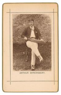 Arthur Shrewsbury. Nottinghamshire & England 1875-1902. Sepia cabinet card photograph of Shrewsbury, seated wearing cricket attire and holding a bat, with printed title below, black border surround, gilt to card edges. This same image was used as a bookpl