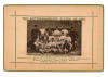 &lsquo;The Nottinghamshire Eleven of 1884&rsquo;. Sepia cabinet card photograph of the county team, seated and standing in rows, with printed title above and players&rsquo; names below, black border surround, gilt to card edges. Players include Shaw, Gunn, Shrewsbury, Atte
