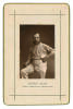 Alfred Shaw. Nottinghamshire, Sussex & England 1864-1897. Sepia cabinet card photograph of Shaw, standing wearing cricket attire and holding a ball, with printed title below, black border surround, gilt to card edges. This same image was used as a bookpla