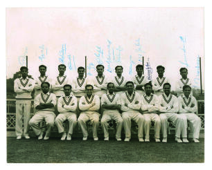 Indian tour of England 1959. Mono press photograph of the entire Indian touring party, seated and standing in rows, in cricket attire. Signed to the top border by thirteen of the seventeen players featured. Signatures include Gaekwad (Captain), Desai, Bor