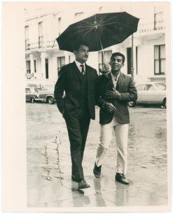 Ajit Laxman Wadekar. Bombay & India 1958-1975. Three original mono press photographs, two of Wadekar in batting action, the other of Wadekar walking on a London street in 1971 with a youthful Sunil Gavaskar in the rain under an umbrella. All three signed 