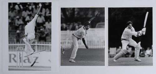 Kapil Dev Ramlal Nikhanj. Haryana, Northamptonshire & India 1975-1994. Three original mono press photographs of Kapil Dev, two in bowling action, 6.5&rdquo;x8.5&rdquo;, the other batting, both 8&rdquo;x10&rdquo;. Each photograph signed by Kapil Dev. Photographers/ agencies are A