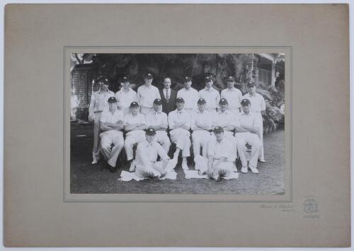 M.C.C. Tour of India 1933/34. Large rare official mono photograph of the M.C.C. team who toured India, seated and standing in rows and wearing cricket attire and tour caps. Players are Jardine (Captain), Walters, Elliott, Townsend, Nichols, Valentine, Gre