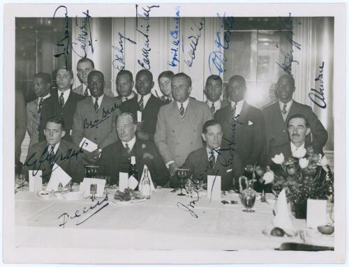 West Indies tour to England 1933. Original mono press photograph of members of the West Indies touring party attending a formal dinner. The photograph fully signed in ink by all fifteen featured players and dignitaries. Signatures are Roach, Barrow, Merry