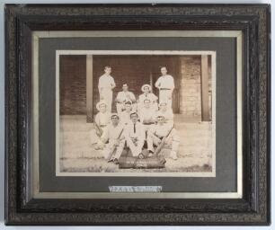 &lsquo;H.M.S. Alacrity 1902-05&rsquo;. A lovely original sepia photograph of a cricket team made up by members of the ship&rsquo;s crew, seated and standing in rows wearing cricket attire on the steps of a pavilion in Shanghai. At the feet of the players is a cricket kit b