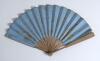 &lsquo;The Eton [and Harrow] Fan. Lord&rsquo;s 1875&rsquo;. A concertina hand fan with chromolithographic print in gold ink on a cornflower blue paper background comprising title to centre and players for both Eton and Harrow teams listed to either side within decorative b - 2