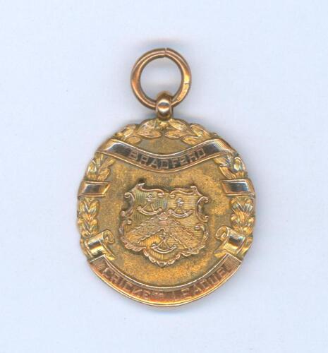 Sydney Francis Barnes, Warwickshire, Lancashire, Staffordshire, England & Wales 1894-1930. Ornate hallmarked nine carat gold medal presented to Barnes for his outstanding performance for Saltaire in the 1917 season. The medal was presented by the &lsquo;Bradfor