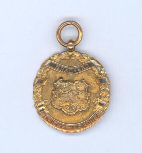 Sydney Francis Barnes, Warwickshire, Lancashire, Staffordshire, England & Wales 1894-1930. Ornate hallmarked nine carat gold medal presented to Barnes for his outstanding performance for Saltaire in the 1917 season. The medal was presented by the &lsquo;Bradfor
