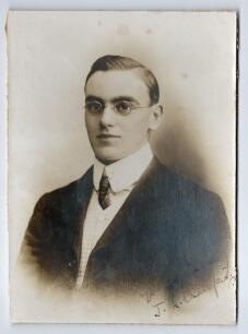 John Neville &lsquo;Jack&rsquo; Crawford. Surrey, South Australia, Otago, Wellington & England 1904-1921. Excellent studio portrait of Crawford taken on the M.C.C. tour of Australia in 1907/08. Crawford is pictured wearing suit and tie. The photograph nicely signed i