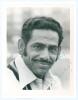 Abid Ali. Mono press photograph of Ali, head and shoulders, nicely signed &lsquo;Best Wishes&rsquo; by Ali. 6.5&rdquo;x8.5&rdquo;. A good image, laid down to card