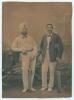 Kumar Shri Ranjitsinhji. Cambridge University, Sussex, London County & England 1893-1920. Original sepia studio portrait photograph of Ranji standing full length alongside another Indian cricketer in a turban. Both players wearing cricket attire and bow t