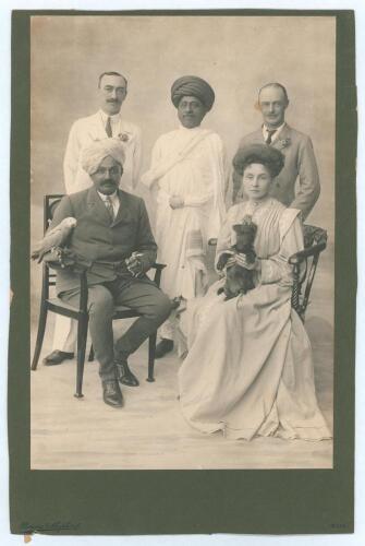 Kumar Shri Ranjitsinhji. Cambridge University, Sussex, London County & England 1893-1920. Original sepia studio portrait photograph of Ranjitsinhji seated with four others. Ranji is depicted wearing a suit and turban, cigarette in his left hand, and his p