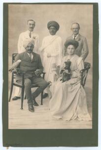 Kumar Shri Ranjitsinhji. Cambridge University, Sussex, London County & England 1893-1920. Original sepia studio portrait photograph of Ranjitsinhji seated with four others. Ranji is depicted wearing a suit and turban, cigarette in his left hand, and his p