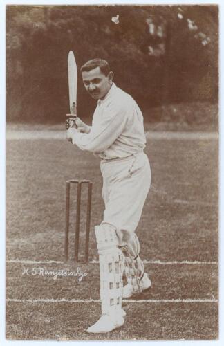 Kumar Shri Ranjitsinhji. Cambridge University, Sussex, London County & England 1893-1920. Early sepia real photograph postcard of Ranji full length at the wicket in batting pose with bat raised. Printed title &lsquo;K.S. Ranjitsinhji&rsquo;. Foster of Brighton. Posta