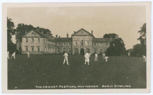 Kumar Shri Ranjitsinhji. Cambridge University, Sussex, London County & England 1893-1920. Early sepia real photograph postcard with printed title &lsquo;The Cricket Festival Hovingham. Ranji Bowling&rsquo; with the match in progress in front of the Hall. Assumed to b