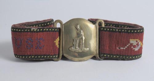 &lsquo;Batsman at the Wicket&rsquo;. Early and complete embroidered belt with oblong shaped brass belt buckle showing a batsman standing at the crease with the wicket behind him circa 1860/70&rsquo;s. The buckle measures 2.25&rdquo;x2.25&rdquo; when joined. The belt embroidered predom