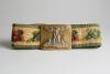 &lsquo;Cricketers under a Tree&rsquo;. Early and complete embroidered belt with oblong shaped brass belt buckle showing four cricketers standing and seated under the shelter of a tree circa 1860/70&rsquo;s. The buckle measures 2.75&rdquo;x2.25&rdquo;. The belt embroidered predominantl
