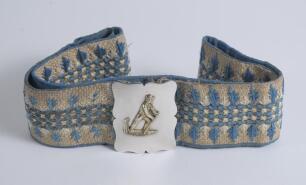 &lsquo;Forward defensive&rsquo;. Early and complete embroidered belt with oblong shaped gilt on silver metal belt buckle showing batsman playing, what appears to be, a forward defensive stroke circa 1860/70&rsquo;s. The belt embroidered predominantly in white, cream and bl