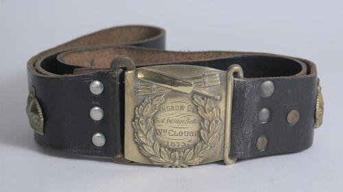 &lsquo;Ingrow Cricket Club. Best Average Batter. Wm Clough 1875&rsquo;. Early and complete black leather belt with square shaped brass belt buckle showing the inscription to centre in a floral wreath with bat and stumps above. There are two brass crowns attached to t
