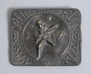 &lsquo;Run&rsquo;. Early Victorian embossed oblong brass belt buckle, with clasp and flat hook to back, depicting to centre a batsman running between the wickets and losing his boater/hat, fielder, the other batsman and ball to background. To all four corners of buck