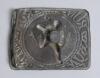 &lsquo;Run&rsquo;. Early Victorian embossed oblong brass belt buckle, with clasp and flat hook to back, depicting to centre a batsman running between the wickets and losing his boater/hat, fielder, the other batsman and ball to background. To all four corners of buck - 2