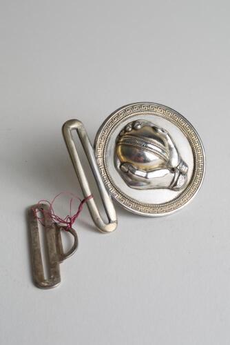 &lsquo;Caught&rsquo;. &lsquo; Early and exquisite Victorian silver and brass circular belt buckle, with clasp to back and hook, depicting a pair of hands holding a cricket ball as if just caught circa 1860/70&rsquo;s. Decorative gilt patterned borders. Approximately 2.75&rdquo;x2&rdquo;. Di