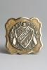 &lsquo;Cricket&rsquo;. Early and exquisite Victorian embossed square brass belt buckle, with clasp to back, decorated to centre with a winners garland, bats, ball and wickets and to the very centre with the title &lsquo;Cricket&rsquo; circa 1860/70&rsquo;s. Decorative patterned border