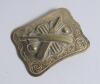 Belt buckle. Early and exquisite Victorian embossed oblong brass belt buckle, with clasp and flat hook to back, decorated to centre with crossed bats, stumps and two balls circa 1860/70&rsquo;s Decorative swirling borders. Approximately 2.5&rdquo;x2&rdquo;. Very good/excel