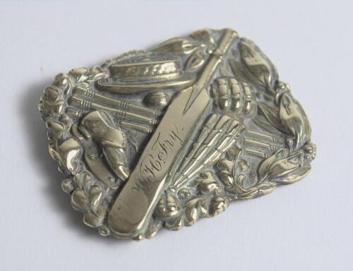 &lsquo;W.H. Fry&rsquo;. Early and exquisite Victorian embossed oblong brass belt buckle, with clasp and flat hook to back, depicting a cricket bat, boater, gloves, pads, stumps, cricket ball and boot with initial&rsquo;s engraved to the bat. Decorative floral borders. Appr