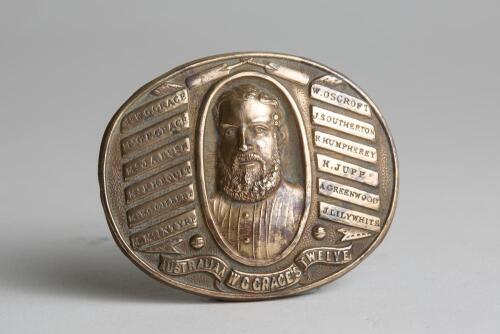 &lsquo;W.G. Grace&rsquo;s tour of Australia 1873/74. Rare and early oval brass belt buckle with impressed image of Grace to centre, to either sides are the names of the twelve cricketers who went on this early tour. To the lower border is the title in scroll &lsquo;W.G. Gr