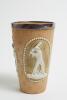 Doulton Lambeth stoneware beaker, moulded in relief with figures in roundels of a batsman (W.G. Grace) in three different poses, the roundels with attractive white beaded decorated border, impressed floral design. Doulton Lambeth impressed marks to base, 