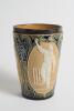 Doulton Lambeth stoneware beaker, moulded with relief vignettes of cricketers, a batsman, bowler and wicket keeper, Abel, Woods and McGregor in white on a brown background. With stylised daisy and floral leaf Art Nouveau decoration to top and sides in gre - 2