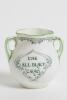 &lsquo;Good for Fifty&rsquo;. Royal Doulton Black Boy miniature two handled vase, with printed image of a boy in red shirt and a floppy hat in batting pose in front of the wicket to one side and to the other, a crest with &lsquo;The All Black Team&rsquo;. Green floral decoration - 3