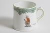 &lsquo;Next Man In&rsquo;. A small Royal Doulton Black Boy mug or tankard, entitled &lsquo;Next Man In&rsquo; printed, to one side, with a boy cricketer in red shirt, grey trousers and a floppy hat, sitting on his bat, waiting to go in, to verso, the crest &lsquo;The All Black Team&rsquo;. 