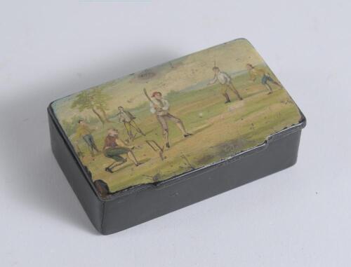 Cricket snuff box. Victorian papier mache oblong snuff box. The hinged lid painted with a colour cricketing scene, after Hayman&rsquo;s painting of 1740. The box measures approximately 3.25&rdquo; long, 2&rdquo; wide and 1&rdquo; deep. Some wear and chipping to the edges of the 