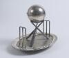 Cricket ball inkwell. An attractive Victorian silver plated inkwell modelled as a cricket ball and supported by three crossed cricket bats with two wickets, one at either end on oval base with balled feet support. The base stamped &lsquo;Holliday, Oxford, 2794&rsquo; - 2