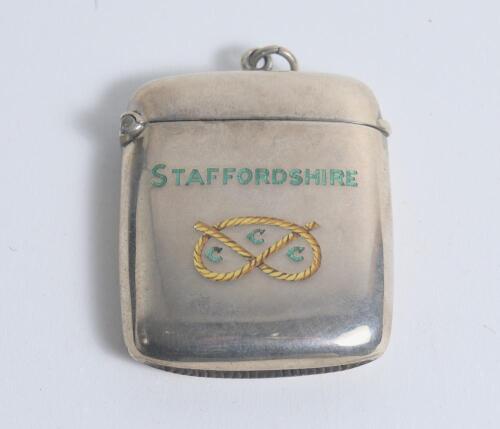 &lsquo;Staffordshire County Cricket Club&rsquo;. Original silver hallmarked vesta case with enamel Stafford shire emblem of the Stafford knot to centre in gold and the clubs title Staffordshire C.C.C. to side. Hallmarked for Birmingham 1906. Ring suspension to top of