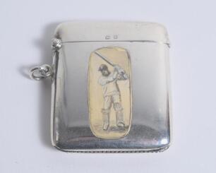 Victorian cricket vesta case. Attractive silver rounded oblong vesta case decorated with an enamel figure of a batsman, wearing a cap, playing a shot. Approximately 2.25&rdquo;x1.75&rdquo;. Hallmarked Birmingham 1915. Makers mark for Arthur S. Zimmerman of Birmingham