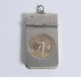 Cricket vesta. Unusual and rare vesta case. The oblong silver metal case with lift up lid has an original photograph of a cricketer, wearing a cap, in fielding position about to throw the ball. Ring suspension. 1&rdquo;x2&rdquo;. An attractive little item