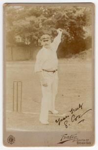 George Rubens Cox (Snr). Sussex 1895-1928. Excellent sepia cabinet card photograph of Cox, full length, wearing cricket attire and Sussex cap and in bowling pose at the wicket. Nicely signed by Cox in ink to image &lsquo;Yours truly, G.R. Cox&rsquo;. Cabinet card by 
