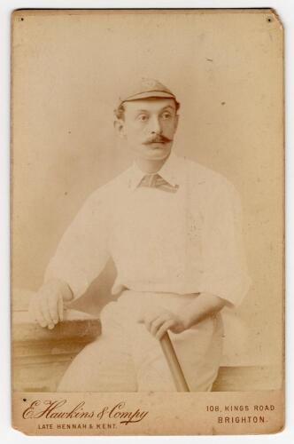 William Newham. Sussex & England 1881-1905. Good sepia cabinet card photograph of Newham, three quarter length, wearing cricket attire and cap holding a bat in his left hand. Appears to be signed in ink by Newham to verso. Cabinet card by E. Hawkins of Br