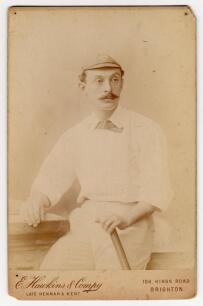 William Newham. Sussex & England 1881-1905. Good sepia cabinet card photograph of Newham, three quarter length, wearing cricket attire and cap holding a bat in his left hand. Appears to be signed in ink by Newham to verso. Cabinet card by E. Hawkins of Br
