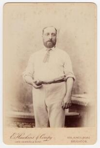 Alfred Shaw. Nottinghamshire, Sussex & England 1864-1897. Excellent sepia cabinet card photograph of Shaw, three quarter length in cricket attire holding a cricket ball. Cabinet card by E. Hawkins of Brighton and measures 4.25&rdquo;x6.5&rdquo;. Good/very good condit